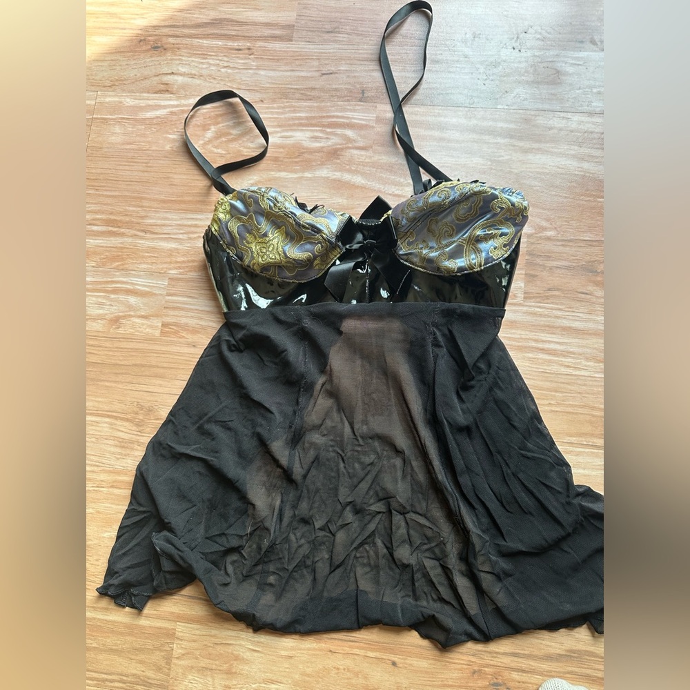 Babydoll lingerie black with blue and gold  breast details.